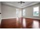 An empty bedroom with dark hardwood floors, tray ceiling and plenty of natural light at 106 Kelly Marie Ct, Kings Mountain, NC 28086