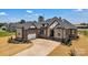 Beautiful two-story home featuring brick and stone accents, with a two-car garage and manicured front yard at 106 Kelly Marie Ct, Kings Mountain, NC 28086