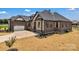 A beautiful home featuring brick and stone accents, with a two-car garage and tastefully landscaped yard at 106 Kelly Marie Ct, Kings Mountain, NC 28086