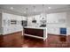 Modern kitchen with white cabinetry, a dark island, stainless steel appliances, and stylish pendant lighting at 106 Kelly Marie Ct, Kings Mountain, NC 28086