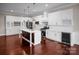 Bright kitchen featuring white cabinets, marble countertops, an island, and stainless steel appliances at 106 Kelly Marie Ct, Kings Mountain, NC 28086