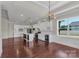 Open concept kitchen with white cabinets, marble counters, stainless appliances, and pendant lighting at 106 Kelly Marie Ct, Kings Mountain, NC 28086