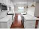 Stylish kitchen with white cabinets, quartz countertops, stainless steel appliances, and dark hardwood floors at 106 Kelly Marie Ct, Kings Mountain, NC 28086