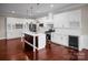 Modern kitchen with white cabinetry, a dark island, stainless steel appliances, and stylish pendant lighting at 106 Kelly Marie Ct, Kings Mountain, NC 28086