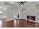 Inviting living room with hardwood floors, fireplace, and a tray ceiling at 106 Kelly Marie Ct, Kings Mountain, NC 28086