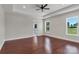 Spacious bedroom with tray ceiling, ceiling fan, and large windows offering an abundance of natural light at 106 Kelly Marie Ct, Kings Mountain, NC 28086