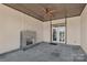 Covered patio with stone fireplace, ceiling fan, and tiled floor at 106 Kelly Marie Ct, Kings Mountain, NC 28086