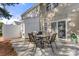 Outdoor patio with dining set, string lights, and fenced-in yard at 11023 Kinston Ridge Pl, Charlotte, NC 28273