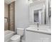Modern bathroom featuring a tiled shower, white vanity, and contemporary fixtures at 11023 Kinston Ridge Pl, Charlotte, NC 28273