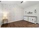 Bedroom features neutral wallpaper, modern decor, and vaulted ceilings at 11023 Kinston Ridge Pl, Charlotte, NC 28273