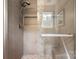 Modern shower features a built-in shelf and stone tile at 11023 Kinston Ridge Pl, Charlotte, NC 28273