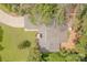 Aerial view of the home, showcasing its layout, roof, driveway, and surrounding greenery at 11834 Carmel Lakes Dr, Charlotte, NC 28226