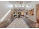 Bright dining area with a long wooden table and views of the surrounding living spaces at 11834 Carmel Lakes Dr, Charlotte, NC 28226
