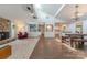 Open concept dining and kitchen area featuring a rustic wooden table and bright white finishes at 11834 Carmel Lakes Dr, Charlotte, NC 28226