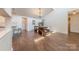Sun-lit dining area with hardwood floors and contemporary chandelier at 11834 Carmel Lakes Dr, Charlotte, NC 28226