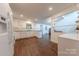 Open-concept kitchen featuring stainless steel appliances and easy access to living spaces at 11834 Carmel Lakes Dr, Charlotte, NC 28226