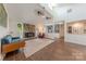 Bright, open-concept living space featuring a stone fireplace and seamless flow to other rooms at 11834 Carmel Lakes Dr, Charlotte, NC 28226