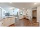 Open concept featuring a dining area connected to the kitchen, with clear sight lines at 11834 Carmel Lakes Dr, Charlotte, NC 28226