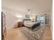 Spacious main bedroom with a blue accent wall, an accent rug, and double french doors at 11834 Carmel Lakes Dr, Charlotte, NC 28226