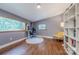 Office space featuring multiple windows, a hardwood floor, and a comfortable desk chair at 11834 Carmel Lakes Dr, Charlotte, NC 28226