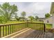 Wooden back deck overlooks the property, offering a perfect space for outdoor seating and entertaining at 120 Tower Dr, Statesville, NC 28677