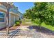 Serene backyard featuring a paver patio, lush greenery, a fire pit, and a fenced area at 1325 Grantwood Nw Ave, Concord, NC 28027
