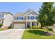 Charming two-story home with stone accents, a two-car garage, and manicured landscaping in a desirable neighborhood at 1325 Grantwood Nw Ave, Concord, NC 28027