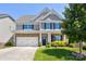 Charming two-story home with stone accents, a two-car garage, and manicured landscaping in a desirable neighborhood at 1325 Grantwood Nw Ave, Concord, NC 28027