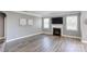 Spacious living room with wood floors, fireplace, and plenty of natural light at 1325 Grantwood Nw Ave, Concord, NC 28027