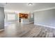 Open floor plan featuring hardwood floors that seamlessly blend the living room and kitchen area at 1325 Grantwood Nw Ave, Concord, NC 28027