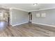 Spacious living room with hardwood floors and neutral paint, perfect for entertaining at 1325 Grantwood Nw Ave, Concord, NC 28027