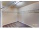 A spacious walk-in closet features built-in shelving for optimal storage and organization at 1325 Grantwood Nw Ave, Concord, NC 28027