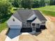 Beautiful new construction home with a welcoming front porch and attached two-car garage at 133 Harbourtown Dr, Kings Mountain, NC 28086