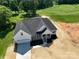 New construction home on a lush green golf course with a large driveway and welcoming front porch at 133 Harbourtown Dr, Kings Mountain, NC 28086