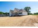 Beautiful home with a white exterior, inviting front porch, and well-manicured lawn at 133 Harbourtown Dr, Kings Mountain, NC 28086