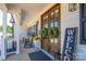Inviting front porch with double doors, rocking chairs, and charming decor at 133 Harbourtown Dr, Kings Mountain, NC 28086