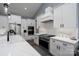 Gourmet kitchen with white cabinets, stainless steel appliances, and subway tile backsplash at 133 Harbourtown Dr, Kings Mountain, NC 28086