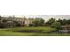 View of the Ballantyne clubhouse with a pond and golf course at 15009 Fanning Manor Ct, Charlotte, NC 28277