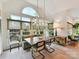Bright dining area featuring stylish furnishings, a chandelier, and a view of the outdoor space at 15009 Fanning Manor Ct, Charlotte, NC 28277