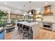Gourmet kitchen with an island, stainless steel appliances, and a cozy breakfast nook at 15009 Fanning Manor Ct, Charlotte, NC 28277