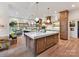 Gourmet kitchen with an island, stainless steel appliances, and a cozy breakfast nook at 15009 Fanning Manor Ct, Charlotte, NC 28277