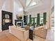 Bright living room featuring a fireplace, stylish furnishings, and access to the outdoor space at 15009 Fanning Manor Ct, Charlotte, NC 28277