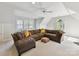 Spacious living room features plush seating, a ceiling fan, and natural light at 15009 Fanning Manor Ct, Charlotte, NC 28277