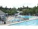 Large community pool with water slide and sunbathing areas at 15009 Fanning Manor Ct, Charlotte, NC 28277