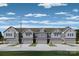 Charming townhome with a gray exterior, a one-car garage, and lush green lawn at 164 Quartz Hill Way, Waxhaw, NC 28173