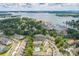 Stunning aerial view featuring a lake, marina, and residential community with swimming pool at 17431 Tuscany Ln, Cornelius, NC 28031