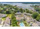 Beautiful aerial view of a condo community by the lake with a pool, green spaces, and boat harbor at 17431 Tuscany Ln, Cornelius, NC 28031