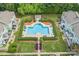 Aerial view of a well-maintained community pool surrounded by lush landscaping at 17431 Tuscany Ln, Cornelius, NC 28031