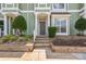 Inviting front entrance with a well-kept lawn and neatly trimmed shrubs for added curb appeal at 17431 Tuscany Ln, Cornelius, NC 28031