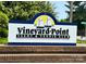 Welcome to Vineyard Point Yacht & Tennis Club sign on a sunny day at 17431 Tuscany Ln, Cornelius, NC 28031